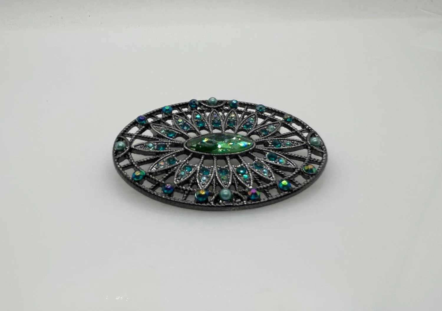 Green and Blue Rhinestone Edwardian Style Brooch in Blackened Frame