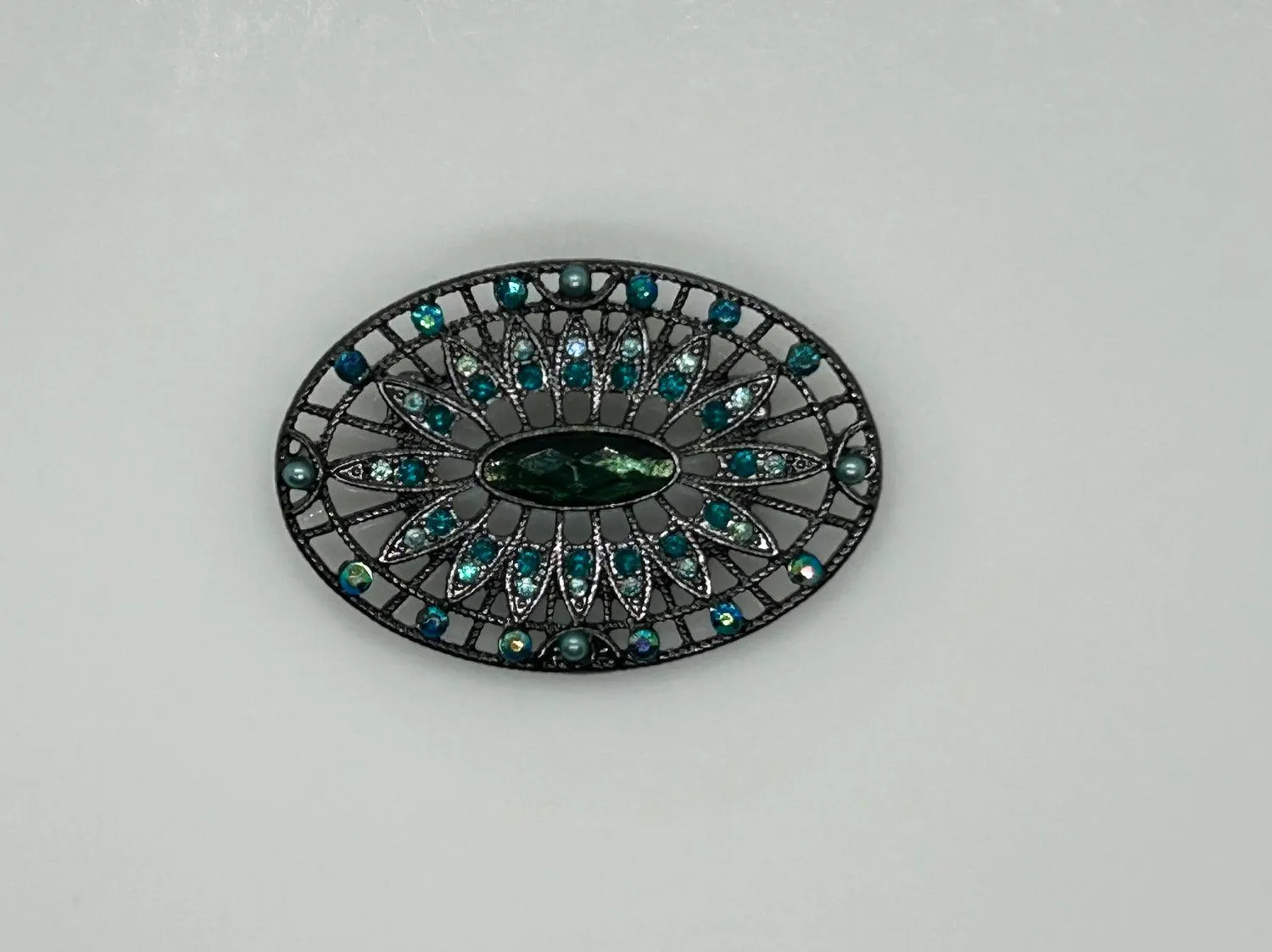 Green and Blue Rhinestone Edwardian Style Brooch in Blackened Frame