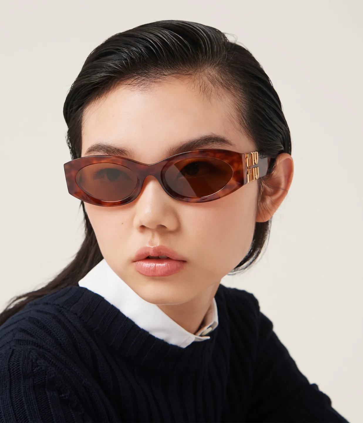 Miu Miu Oval Sunglasses in Brown Havana