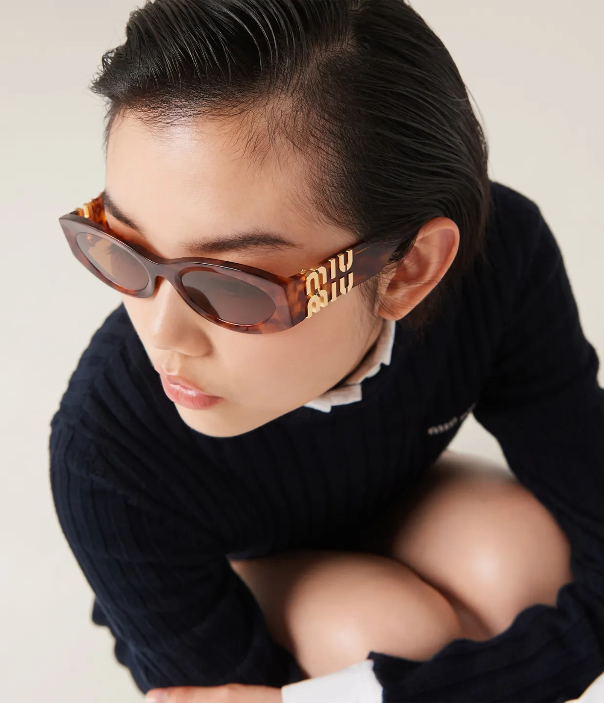 Miu Miu Oval Sunglasses in Brown Havana