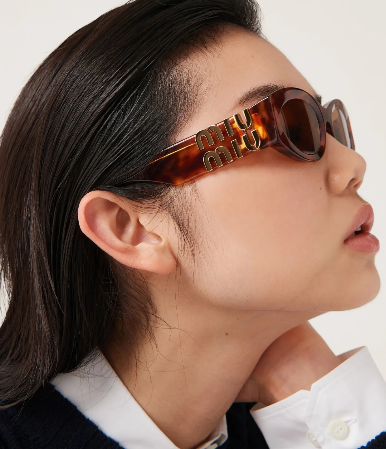 Miu Miu Oval Sunglasses in Brown Havana