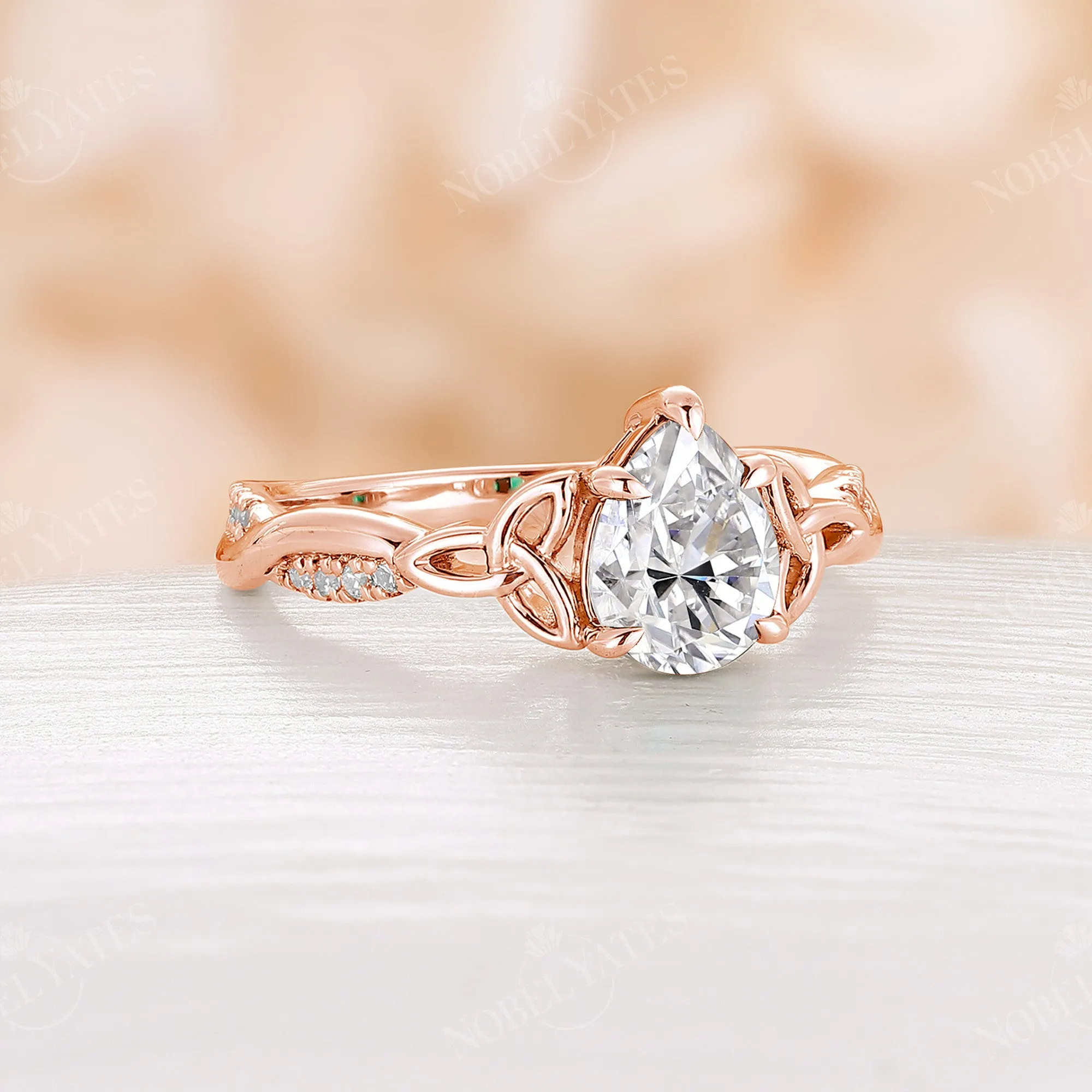 Pear Cut Moissanite Rose Gold Celtic Twist Engagement Ring