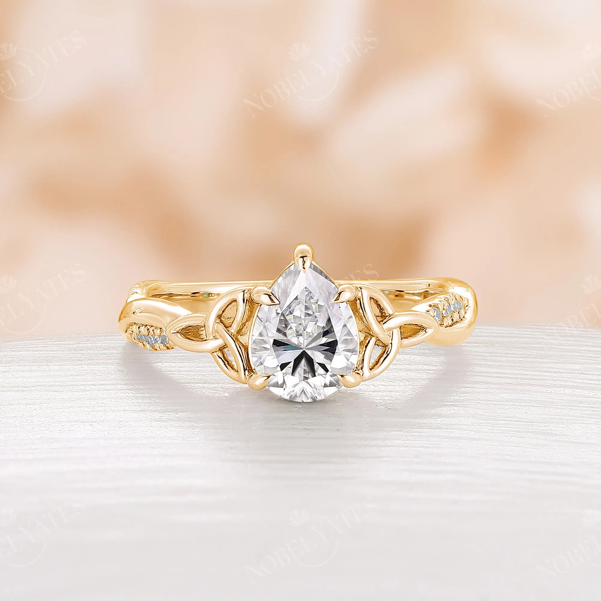 Pear Cut Moissanite Rose Gold Celtic Twist Engagement Ring