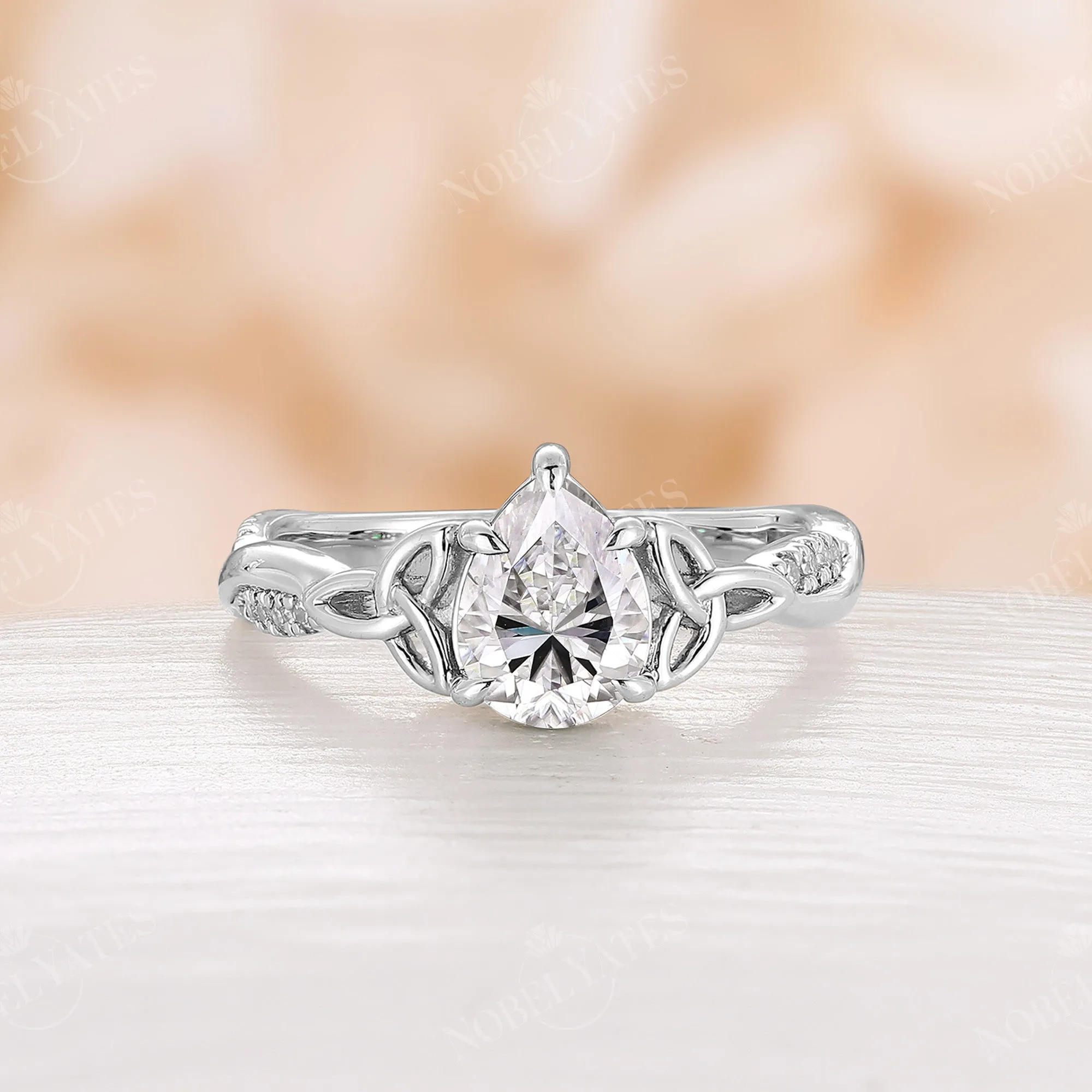 Pear Cut Moissanite Rose Gold Celtic Twist Engagement Ring