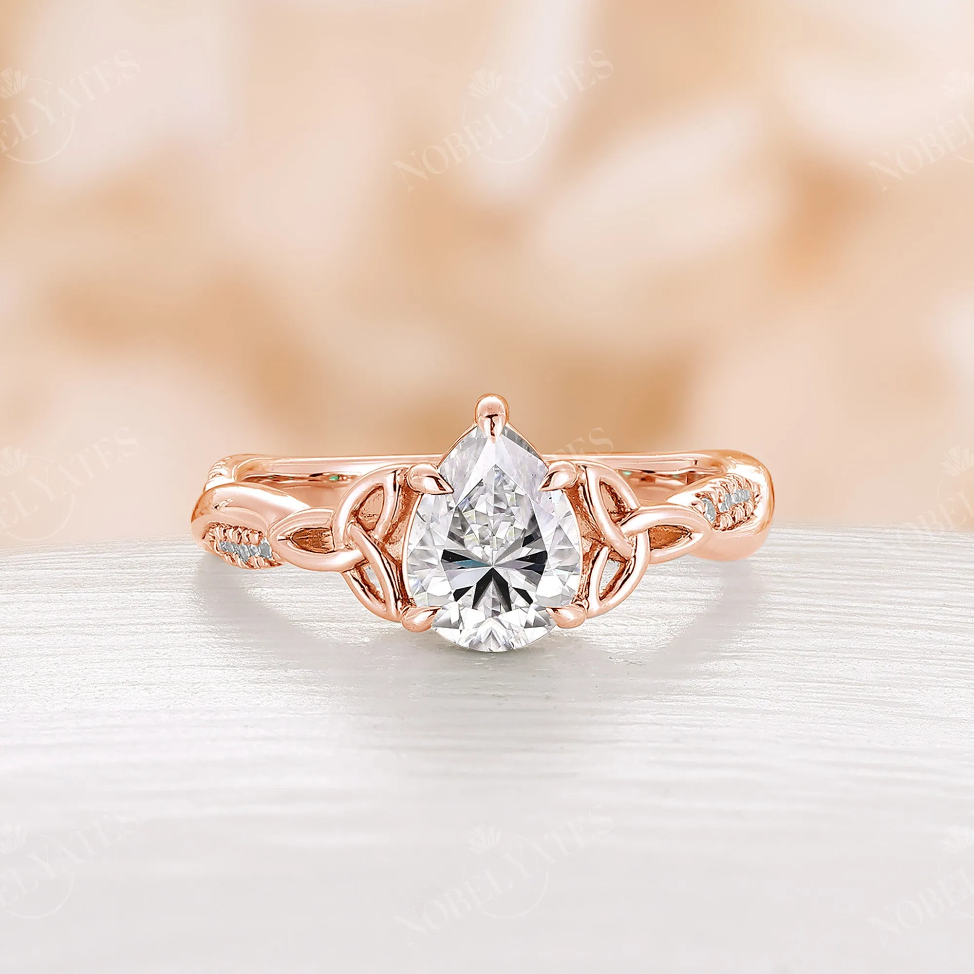 Pear Cut Moissanite Rose Gold Celtic Twist Engagement Ring