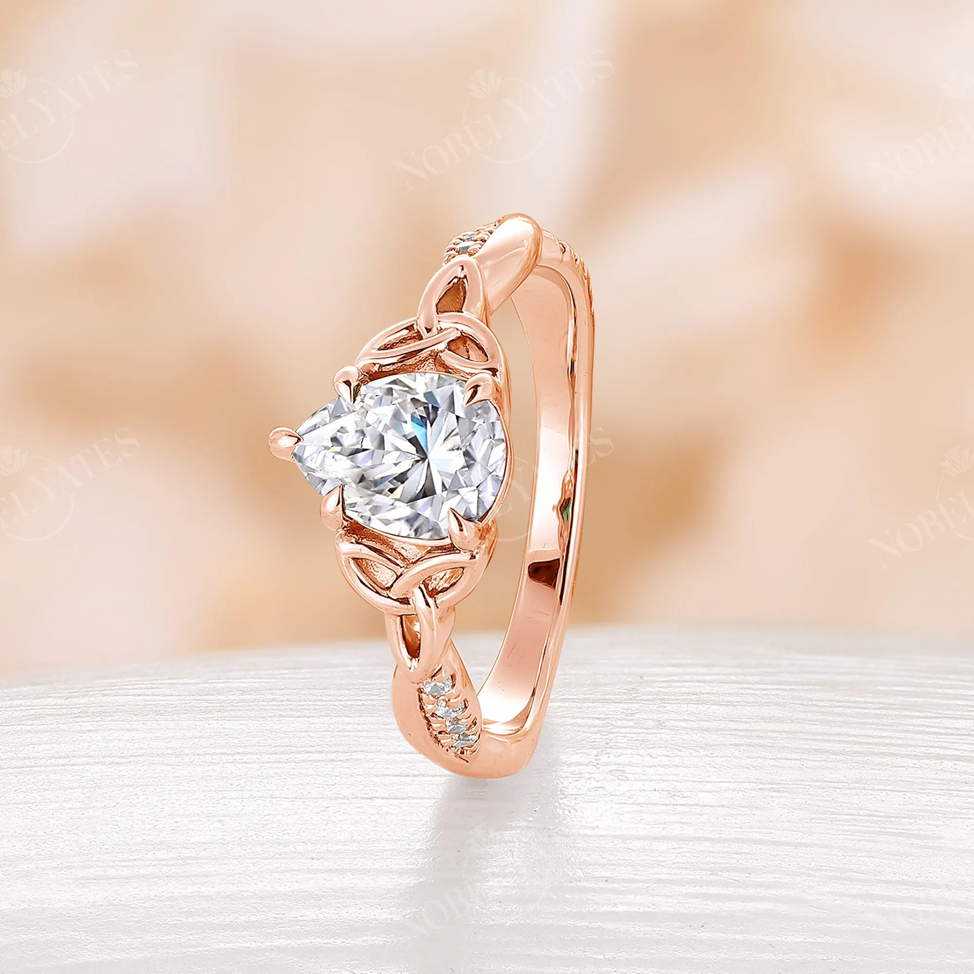 Pear Cut Moissanite Rose Gold Celtic Twist Engagement Ring